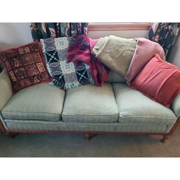 Antique Green Couch with Carved Wooden Details, Includes Blankets and Cushions 76 L, 35 T, 24 W