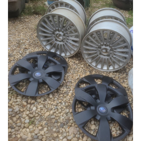 Four 15-Inch Alloy Wheels and Four Subaru Hubcaps