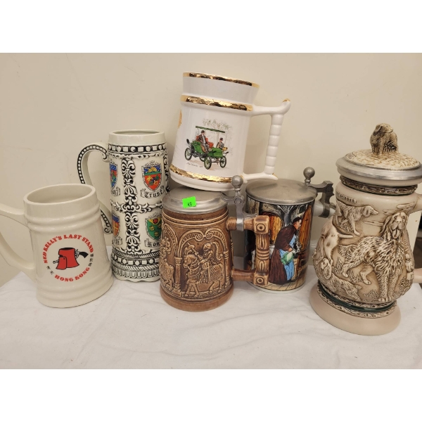 Six Ceramic and Stoneware Beer Steins and Tankards with Varied Designs