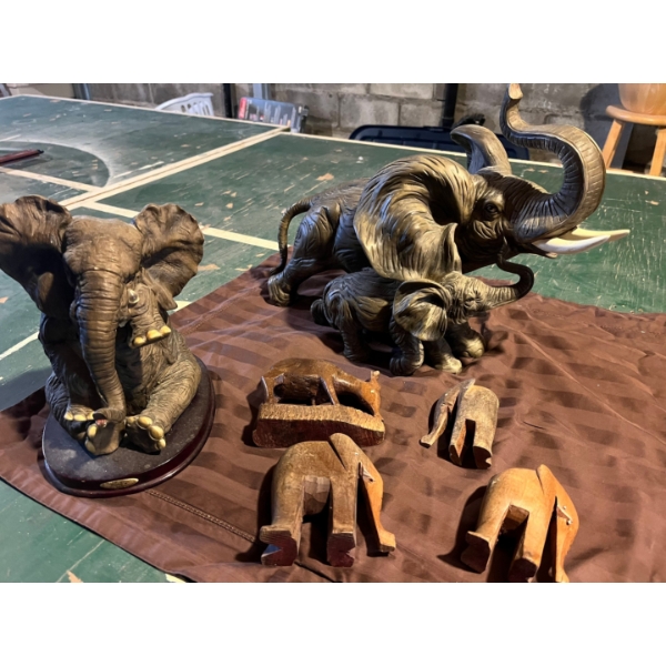 collection of elephants and small wood statues