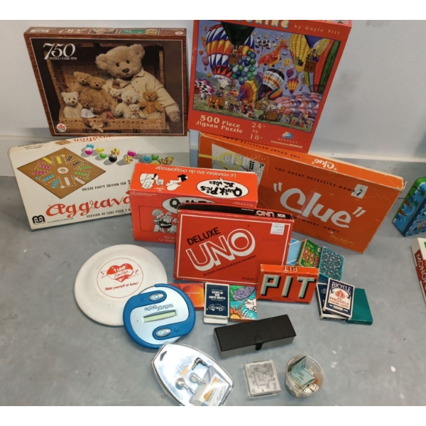Assorted Games & Puzzles  Deluxe Uno, Clue, Quick Picks, Aggrivation, PIT,++750 & 500 Piece Puzzles