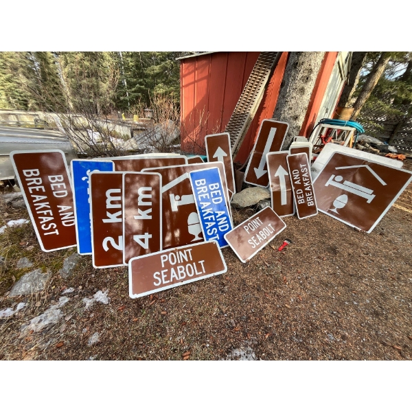 Large Collection of road signs arrows, bed-and-breakfast signs, 2 km signs 4 km signs point Seabolt 