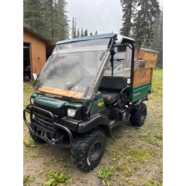 Kawasaki mule 3010 great little unit for around acreage or farm dump box and raised sides on the box