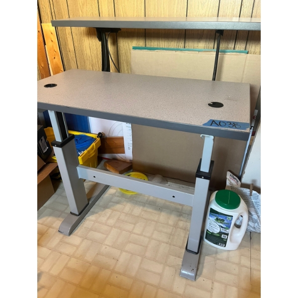 Adjustable sturdy office/work station. Steal frame. Crank to adjust heights.