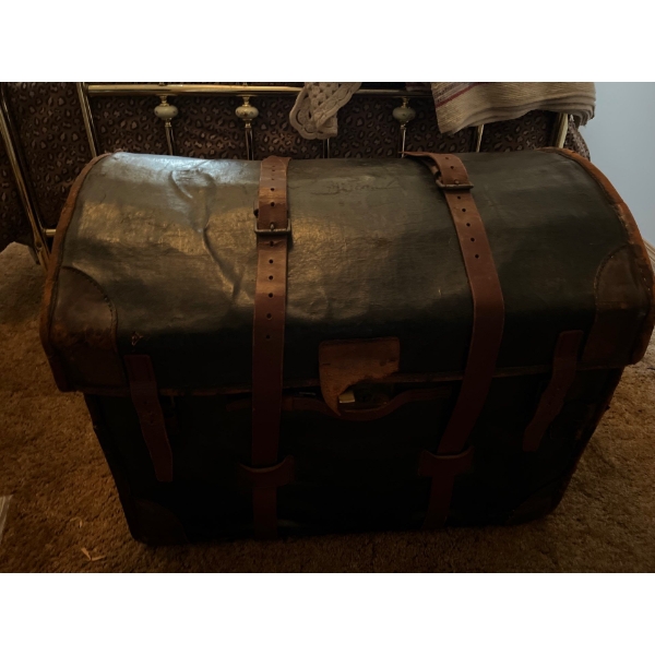 Antique leather shipping trunk with all contents
And a beautiful weaved blanket