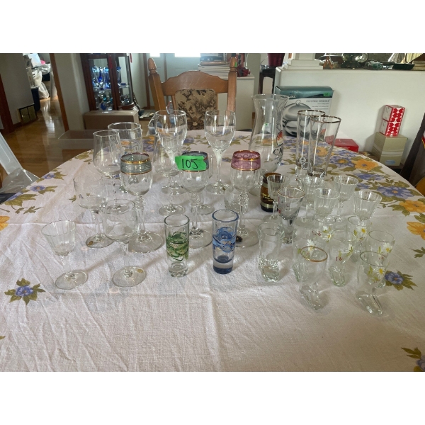 Assorted Drinking Glasses and Shot Glasses.