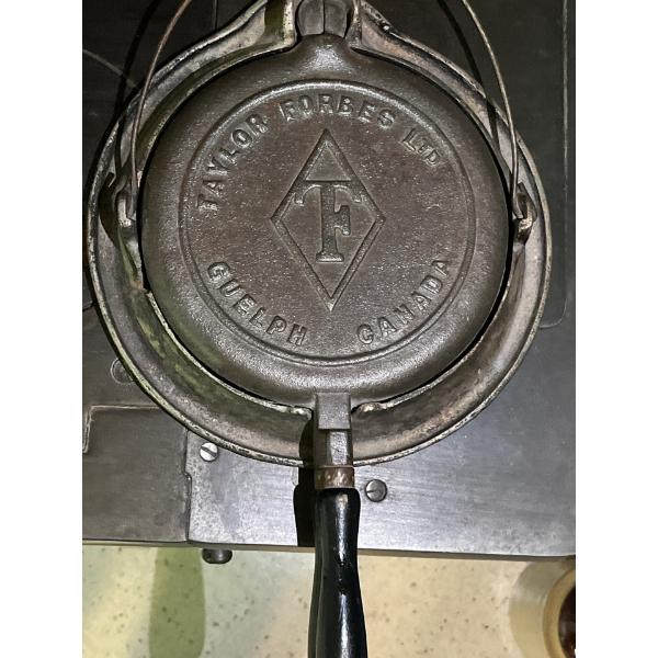 Taylor Forbes cast iron waffle maker. This specific model, marked "Taylor Forbes Ltd", was likely ma