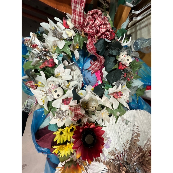 Unique wreath handmade with an assortment of ornaments, large wicker fan with dried flowers and cera