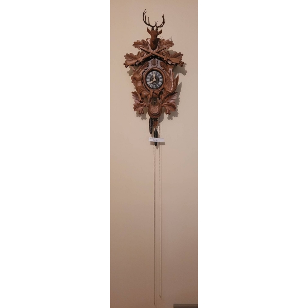 Hand-Carved Wooden Cuckoo Clock with Hunting Theme and Stag Motif
