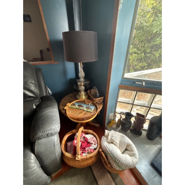  oak round end table with retro lamp and shade with two with baskets and three clay vases