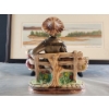 Image 10 : Decorative Delights- Porcelain Figurine, Decorative Bottle, Framed Landscape Bin, and a Tin