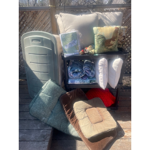 Various Outdoor Cushions and furniture coverings, Storage Tote Included.SHELVING NOT INCLUDED.