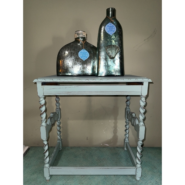 Decorative Glass Bottles and Light Blue Painted Table