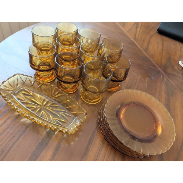 Amber Glass Collection Including Plates, Glasses, and Serving Dish