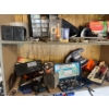 Image 4 :  shelf with contents, including a vintage radio, moving sliders, bolt bins, electric power tools, in
