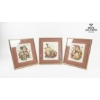 Image 1 : three framed cross-stitch embroideries featuring designs based on the artwork of M.I. Hummel. 