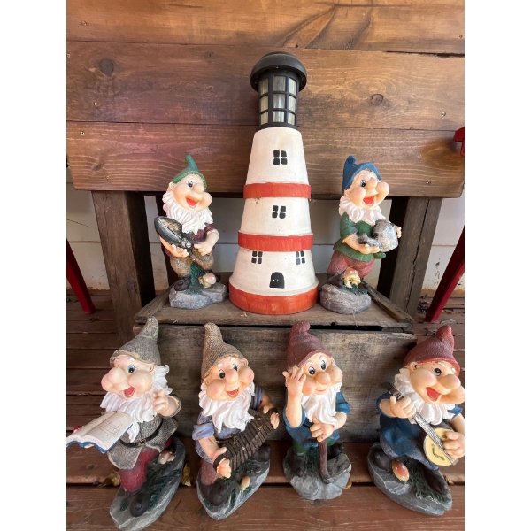 collection of 6 Gnomes and lighthouse and vintage wooden crate .