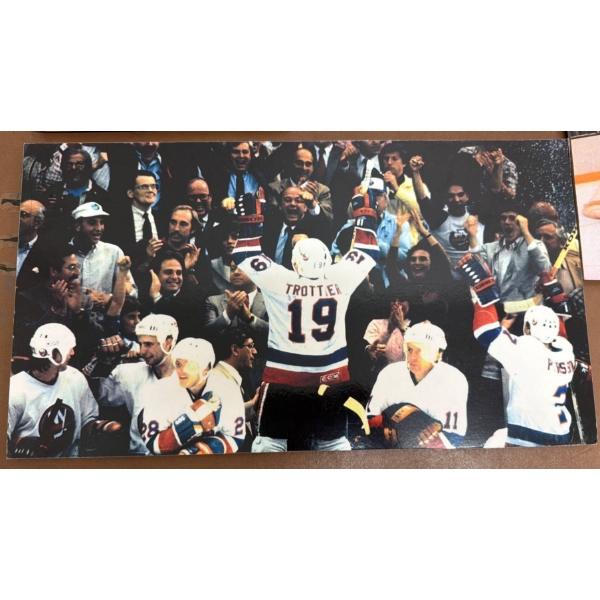 New York Islanders Memorabilia Featuring Signed Photos and Magazines
