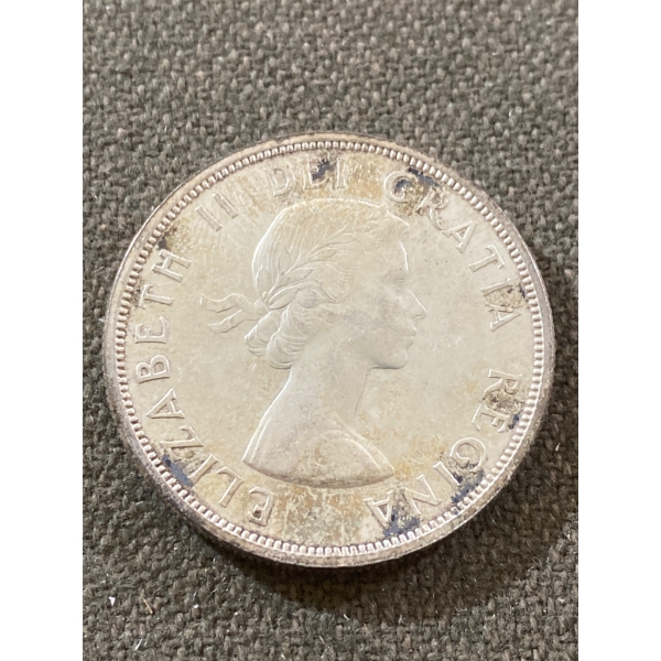 1965 Canada Silver Dollar Coin Featuring Queen Elizabeth II and Voyageur Design