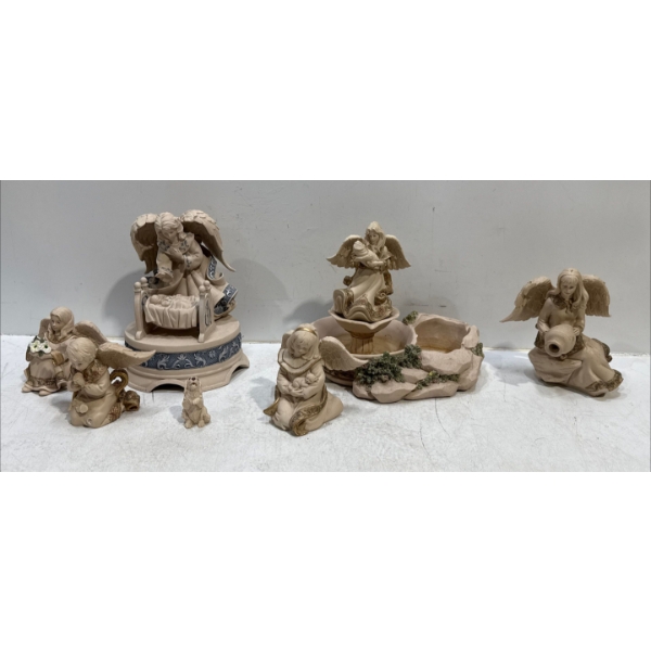 Collection of Angel Figures and Small Dog