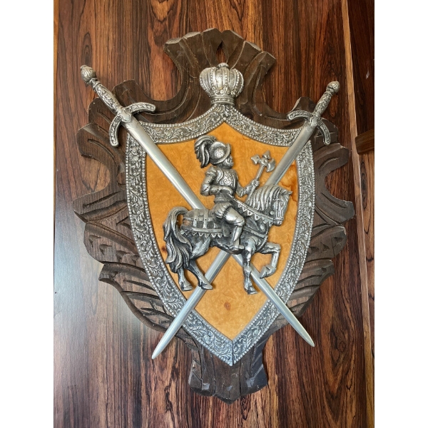 decorative plaque featuring a coat of arms,