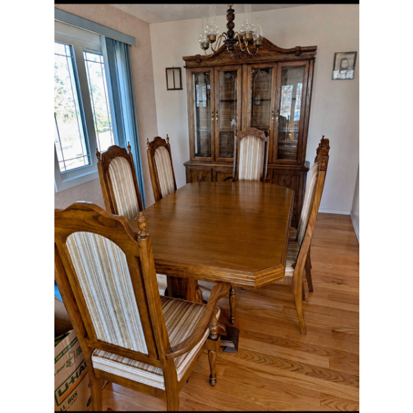  Arcese Brothers Oak table, china cabinet with hutch and 6 chairs (2 end chairs are arm chairs).In B