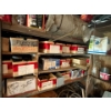 Image 1 : Several labelled boxes with plastic hoses trailer bearings door hardware, pulleys, and irrigation, s