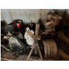 Image 3 :  Tires, lawnmower motors, jacks Bottom left shelf.