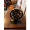 Image 5 : Antique Singer sewing machine, likely manufactured in the early 1900s, housed within its original wo