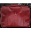 Image 1 : Three Bags: Red Suitcase, Brown Duffel Bag, and Green/Gray Hiking Backpack