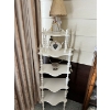 Image 1 : Vintage white corner shelf unit is styled in a French Provincial or shabby chic aesthetic. 