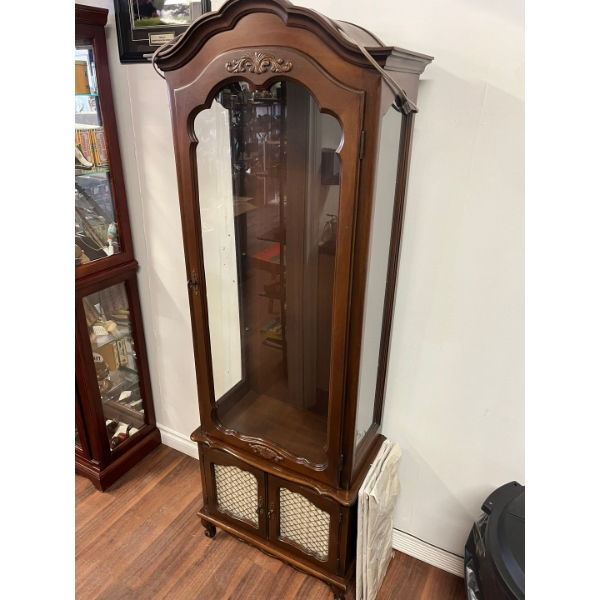 Traditional Style Tuscan Finish Wood Churro cabinet with a curved top and lower storage drawers ligh