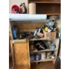 Image 2 : shelf with contents, including saws, cutoff, saws, electric drills, painting supplies, and a number 
