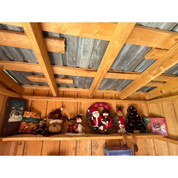 Collection Of Christmas Cook Books And A number Of Plush Christmas Decor Along With A Christmas Wrea