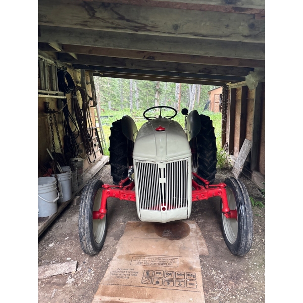 Antique Ford tractor rebuilt and painted currently running new alternator works great for the acreag