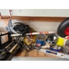 Image 1 : contents of shelf, including a GE garbage disposal, Kenwood speakers, rolling knee cart, laser level