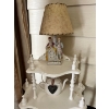 Image 2 : Vintage white corner shelf unit is styled in a French Provincial or shabby chic aesthetic. 