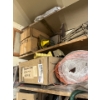 Image 2 : Top two shelves with several miscellaneous items, tools, hardhats boxes of rivets boxes of rope, air