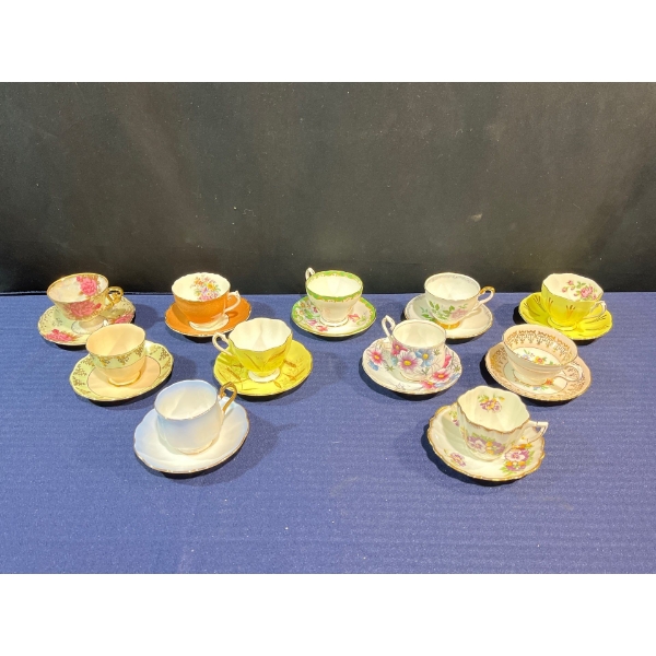 Collection of 11 Cups and Saucers, Brands Include: Royal Albert, Queen Anne, and more