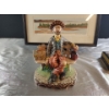 Image 6 : Decorative Delights- Porcelain Figurine, Decorative Bottle, Framed Landscape Bin, and a Tin