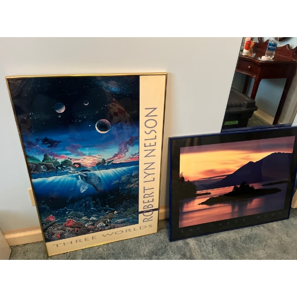 two framed prints one by Robert LYN Nelson named three worlds and The Image Bank artist unknown
