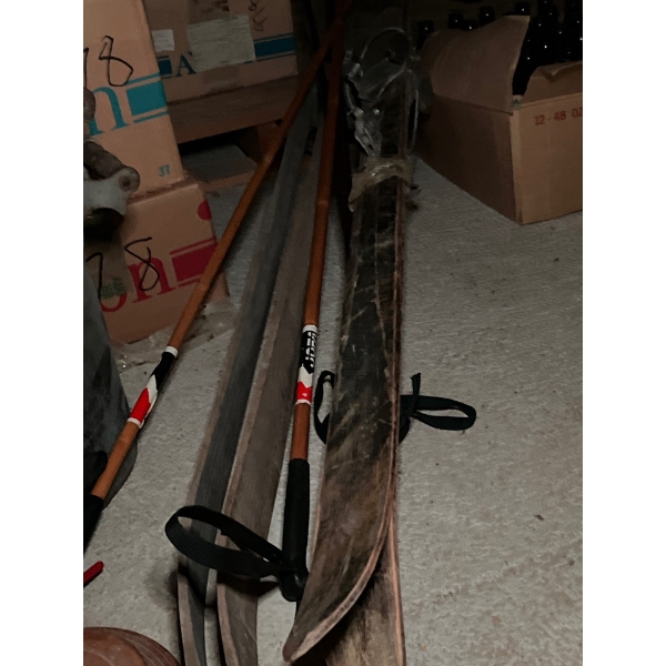 two antique sets of downhill skis, including a number of sets of bamboo poles