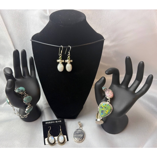 Stamped .925 Jewelry Set Featuring Bracelets, Earrings, and Pendant