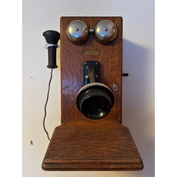 Antique wooden wall-mounted hand-crank telephone, from Northern Electric Company
LIMITED made in the