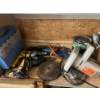 Image 4 : shelf with contents, including saws, cutoff, saws, electric drills, painting supplies, and a number 