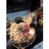 Image 2 :  serving dishes with rooster and hand in basket, laying an egg