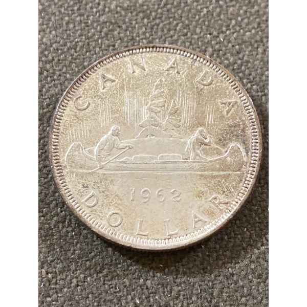 1962 Canadian Silver Dollar Coin Featuring Canoe Design