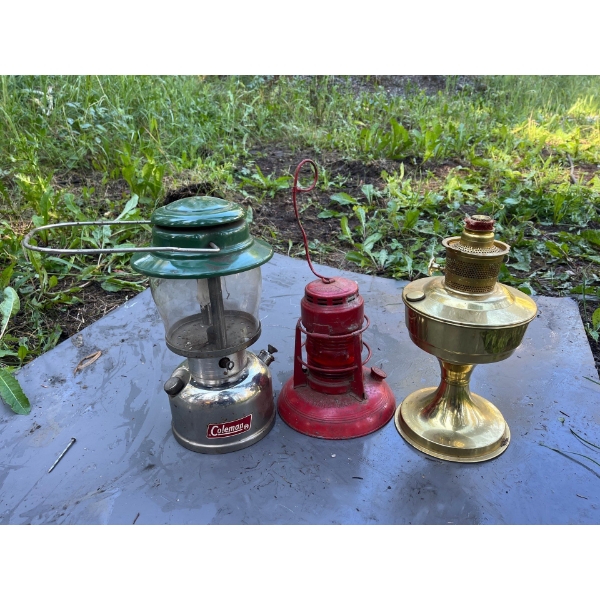 Vintage Coleman lantern, red with red glass lantern from Northern state power company and brass lant