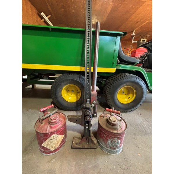 old school Jack made out of solid steel with two vintage gas cans