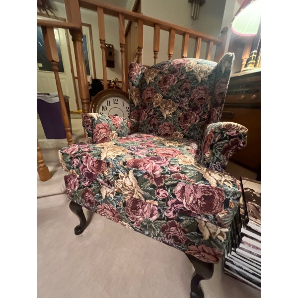 lovely floral high back library chair in amazing condition with wooden legs.
